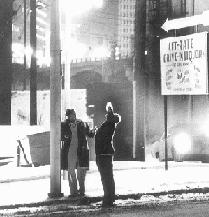 2_men_drinking_under_a_streetlight